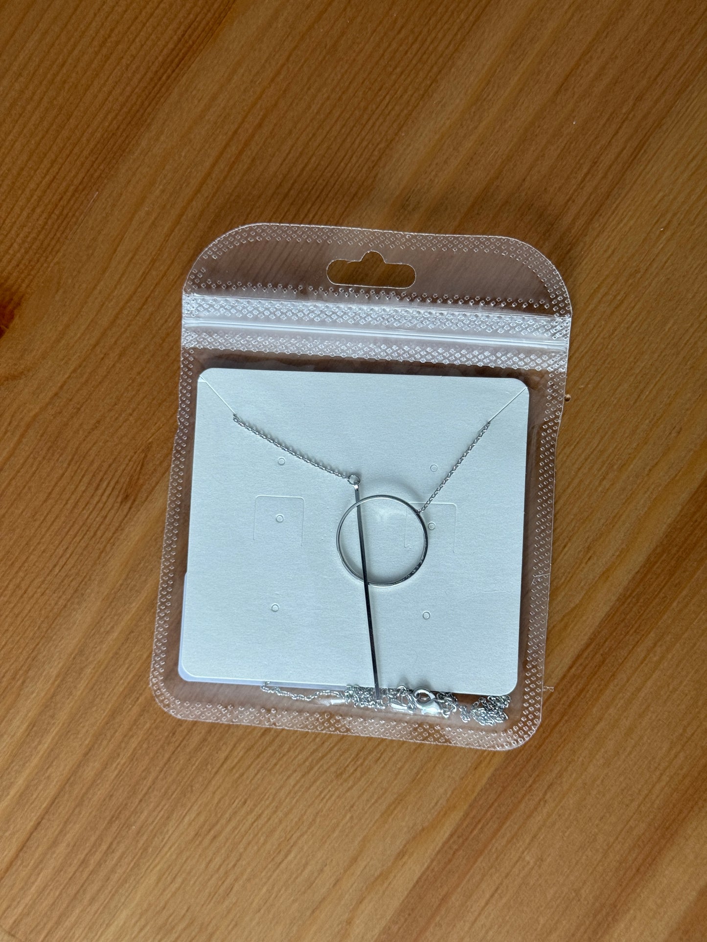 Needle and loop necklace