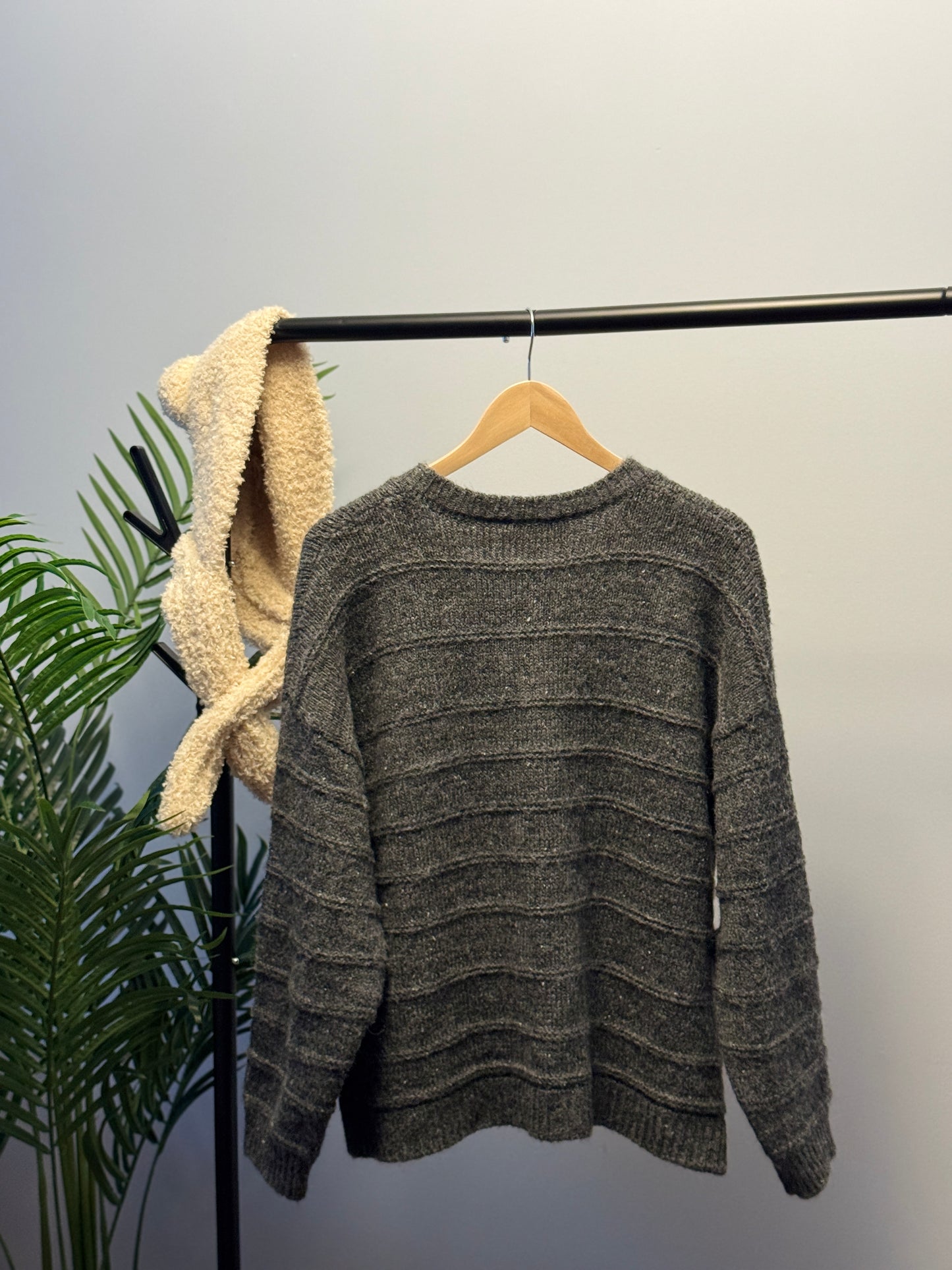 Cardigan with bear pin